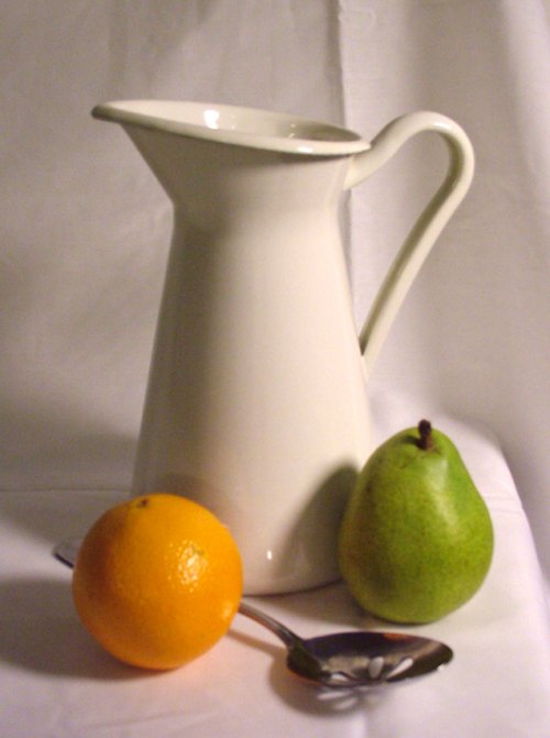 Still life with a pitcher, an orange, a pear, and a spoon